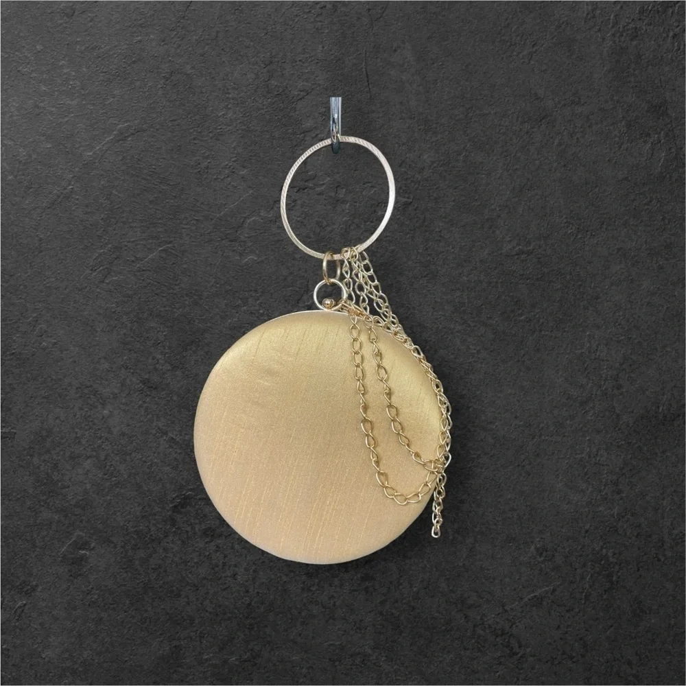 CLUTCHES AND MORE Beige round floral clutch with sequins and bead work.